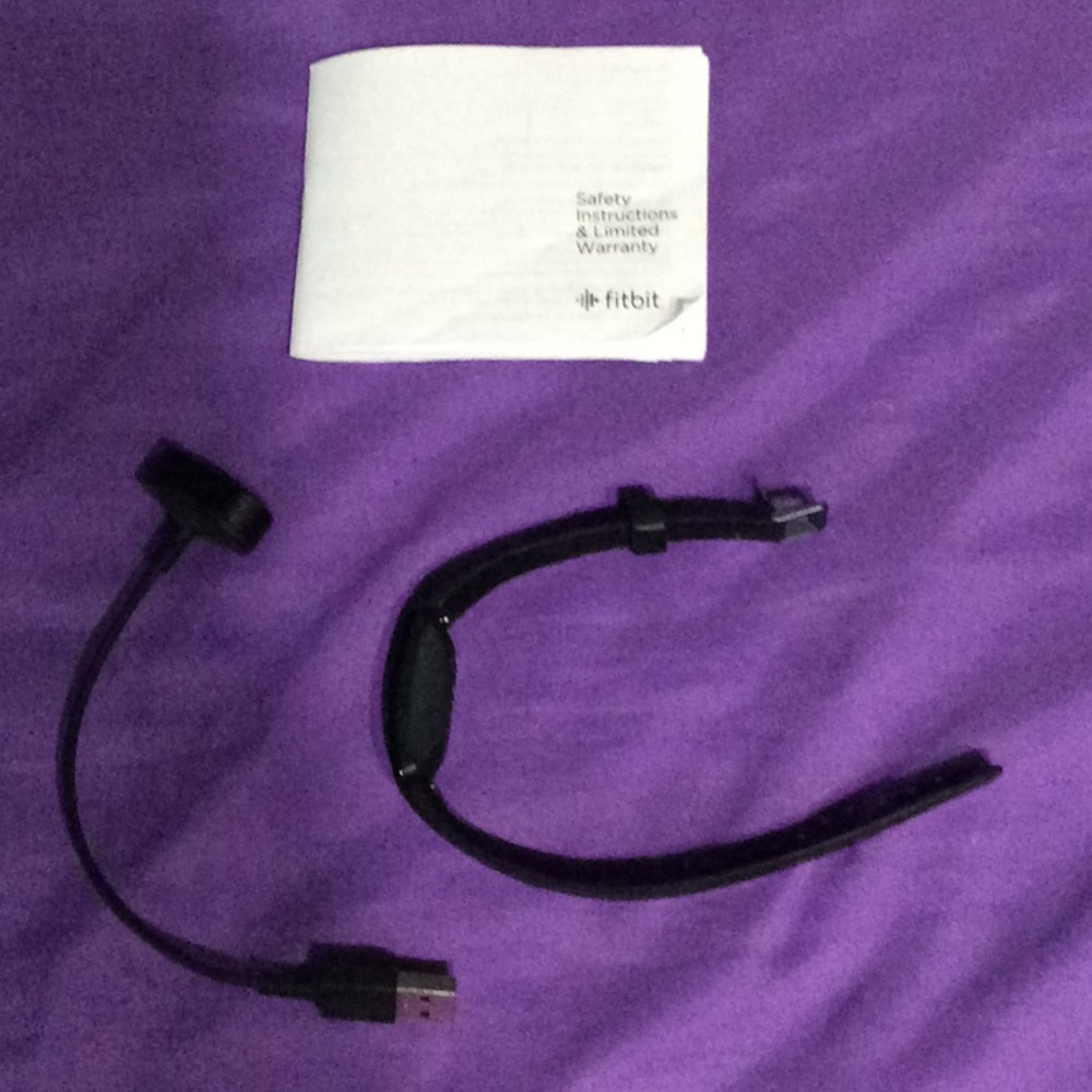 Fitbit with charger and Safety instruction